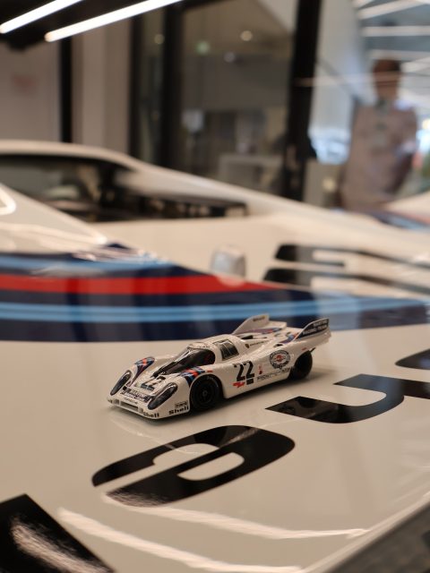 The car Gijs van Lennep drove to overall victory at Le Mans in 1971, photographed in the workshop of the Porsche Museum in Stuttgart. Next to it: my exact scale model of the same car. Some circles take years to close. The full series is live on miniflatsix.com. #porschemoment