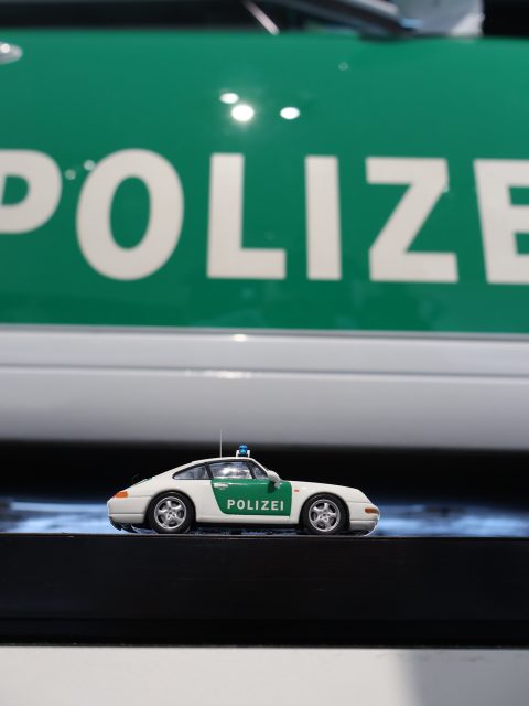 The company car of the German autobahn patrol. A Porsche 993 in full Polizei livery at the Porsche Museum in Stuttgart, an air-cooled 911 that earned its living on the road. The full series is live on miniflatsix.com.